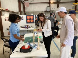 STEM student intern and attendees interact at NBRR
